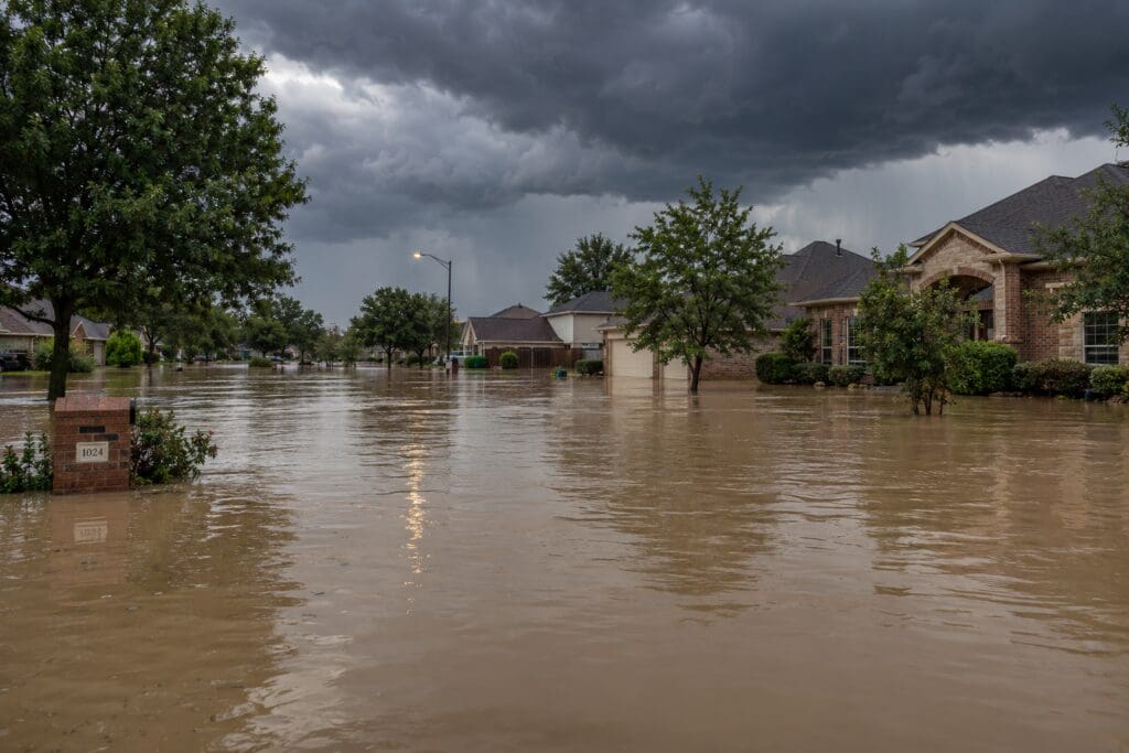 storm flooding in Arlington TX neighborhood causing plumbing and sewer line backup damage